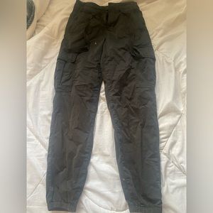 green and black pocketed cargo pants, high waisted and s sinched bottom